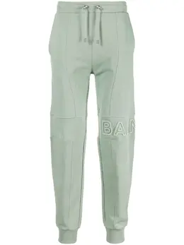 Balmain: Зелёные брюки 