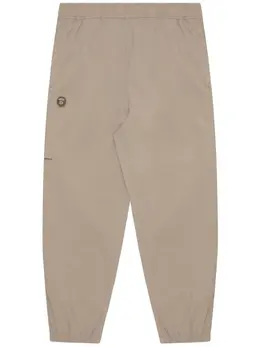 AAPE BY *A BATHING APE®: Бежевые брюки 