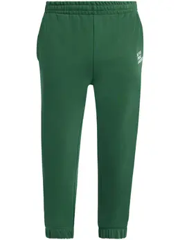 Lacoste: Зелёные брюки 