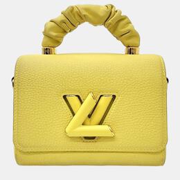 Louis Vuitton: Жёлтая сумка на руку  Twist