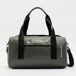 Calvin Klein Jeans: Тёмная дорожная сумка 