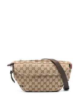 Gucci: Бежевая поясная сумка  GG