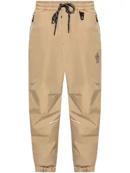 Moncler Grenoble: Бежевые брюки 