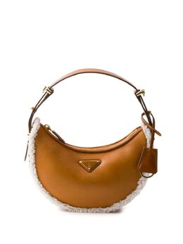 Prada: Коричневая сумка 