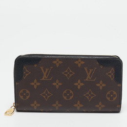 Louis Vuitton: Коричневый кошелёк  Zippy