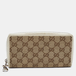 Gucci: Бежевый кошелёк  GG