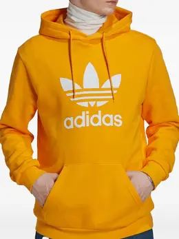 adidas: Оранжевая толстовка  Trefoil