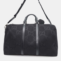 Gucci: Чёрная дорожная сумка  GG
