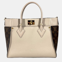 Louis Vuitton: Бежевая сумка 