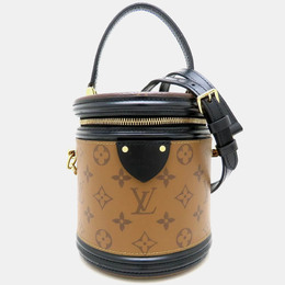 Louis Vuitton: Коричневая сумка 