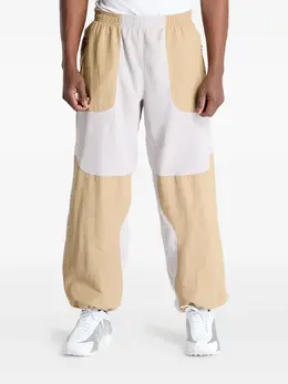 Nike: Бежевые брюки  Plus