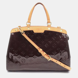 Louis Vuitton: Коричневая сумка 