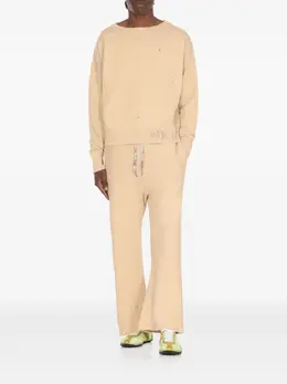 Maison Margiela: Светлые брюки 