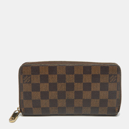 Louis Vuitton: Коричневый кошелёк  Zippy