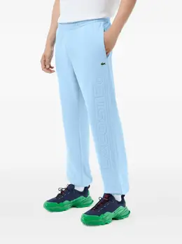 Lacoste: Светлые брюки 