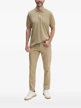 Lacoste: Бежевое поло 
