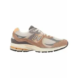 New Balance: Серые кроссовки 