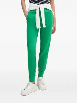 Lacoste: Зелёные брюки 