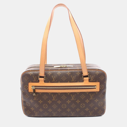 Louis Vuitton: Коричневая сумка 