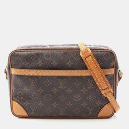 Louis Vuitton: Коричневая сумка через плечо 