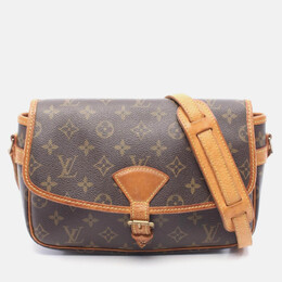 Louis Vuitton: Коричневая сумка 