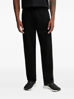 Ea7 Emporio Armani: Чёрные брюки 
