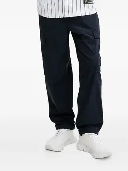 Ea7 Emporio Armani: Синие брюки 