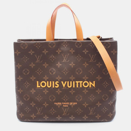 Louis Vuitton: Коричневая сумка-шоппер 