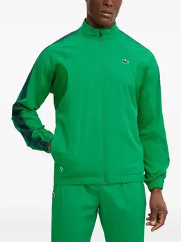 Lacoste: Зелёные брюки 