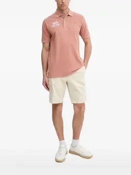 Lacoste: Оранжевое поло 