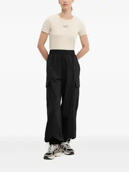 Ea7 Emporio Armani: Чёрные брюки 