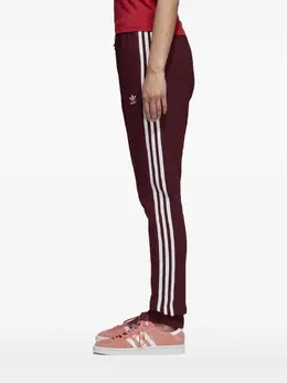 adidas: Красные брюки  Trefoil