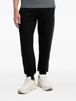 Armani Exchange: Чёрные брюки 