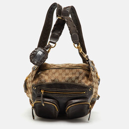 Gucci: Бежевый рюкзак  GG