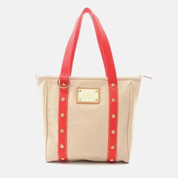 Louis Vuitton: Красная сумка-шоппер 