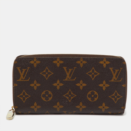 Louis Vuitton: Коричневый кошелёк  Zippy