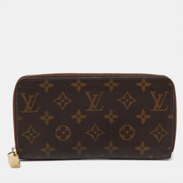 Louis Vuitton: Коричневый кошелёк  Zippy