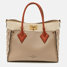 Louis Vuitton: Бежевая сумка 