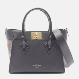 Louis Vuitton: Коричневая сумка 