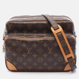 Louis Vuitton: Коричневая сумка 