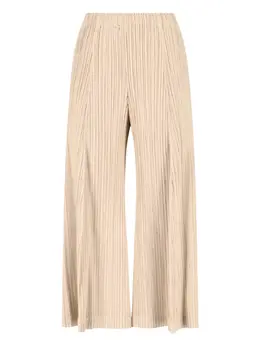 Pleats Please Issey Miyake: Бежевые брюки 