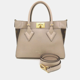 Louis Vuitton: Коричневая сумка 