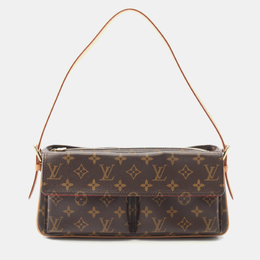 Louis Vuitton: Коричневая сумка 