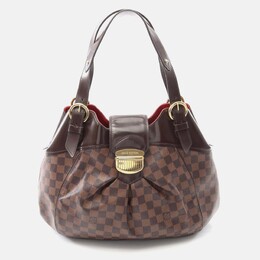 Louis Vuitton: Коричневая сумка 