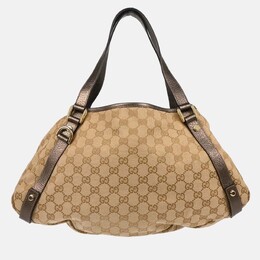 Gucci: Бежевая сумка  GG