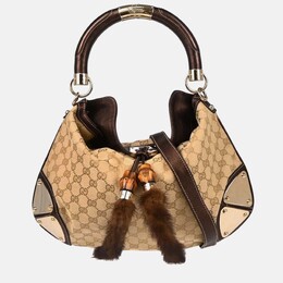 Gucci: Бежевая сумка  GG
