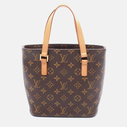 Louis Vuitton: Коричневая сумка 