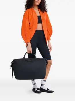 Longchamp: Чёрная дорожная сумка  Le Pliage