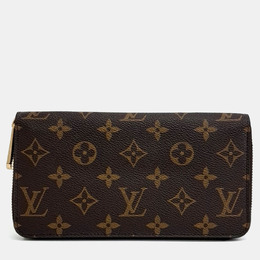 Louis Vuitton: Коричневый кошелёк  Zippy