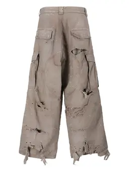 Balenciaga: Рваные брюки 